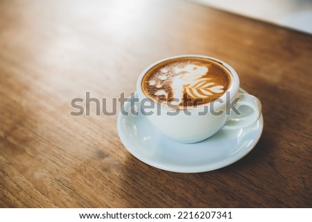 Beautiful latte in a cafe. Beautiful hot coffee. Beautiful latte pattern in a coffee shop.
