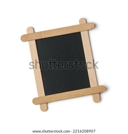 blank frame made of wooden ice cream sticks with black background, close-up of empty photo or text frame isolated on white, copy space