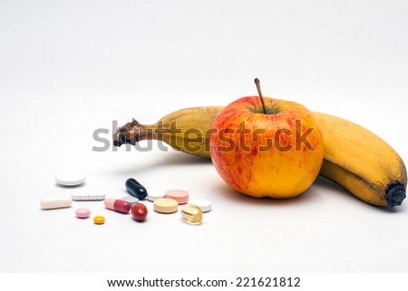 different colored tablets, apple and banana, isolated