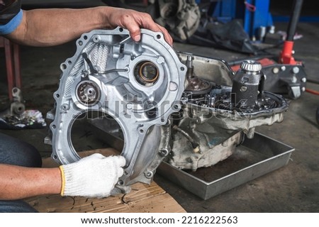 Differential and transfer case rebuilds and repairs ,automatic transmission repair and service in garage service shop. Royalty-Free Stock Photo #2216222563