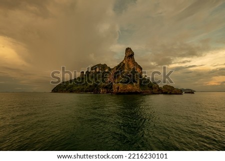 Koh Kai, also known as Koh Dam Kwan, is a strangely shaped island. The names of the islands are many. because of the protruding cliff People who meet will have different fantasies. Royalty-Free Stock Photo #2216230101