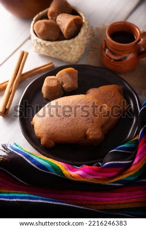 Puerquitos de Piloncillo. Also called Cochinitos, Cerditos or Chichimbres. Traditional Mexican sweet bread with pig shape, usually eaten with pot coffee or hot chocolate.