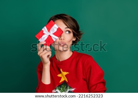 Photo of dreamy sweet lady wear red sweater bow package close eye looking empty space isolated green color background