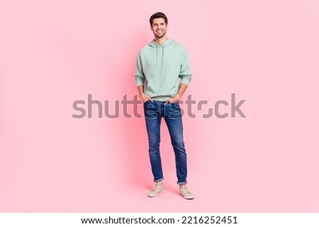 Full size photo of satisfied glad young man toothy smile put hands pockets isolated on pink color background Royalty-Free Stock Photo #2216252451