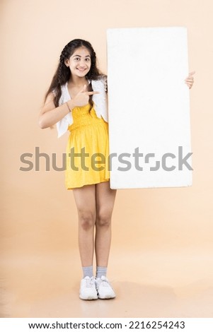 Portrait of Teenage Girl holding sign board