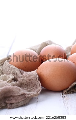 raw chicken eggs on a white background
