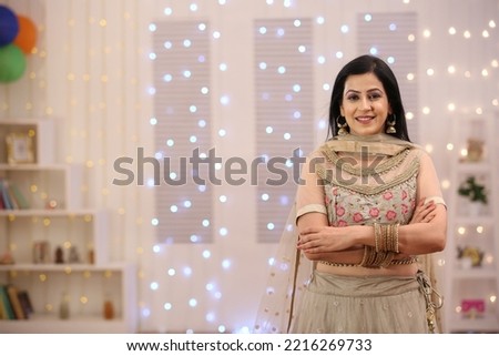 Female celebrating diwali with full of happiness Royalty-Free Stock Photo #2216269733