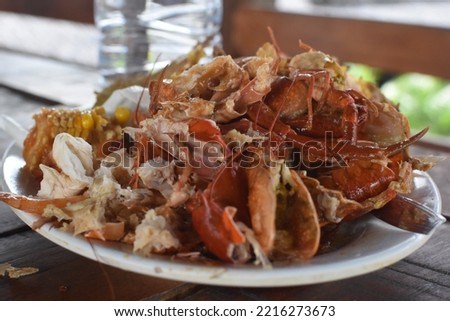 This is called sweet and sour crab and prawns, there are also some other complementary ingredients as shown in the picture