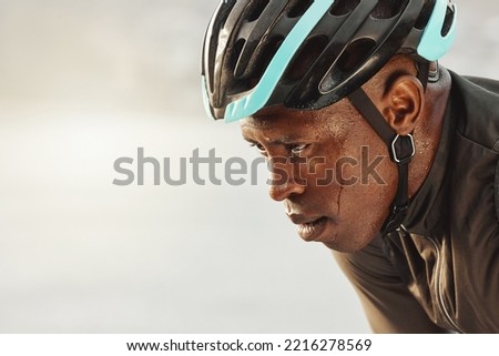 Cyclist man, sweating and focus for marathon race, competition or sports event on sky mock up for advertising space or marketing. Cycling sports person in helmet tired for training fitness challenge