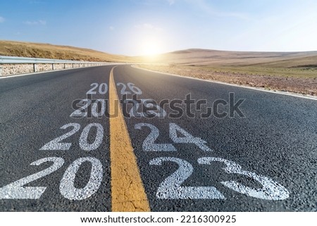 Empty asphalt highway with number 2023, 2024, 2025 and 2026 Royalty-Free Stock Photo #2216300925