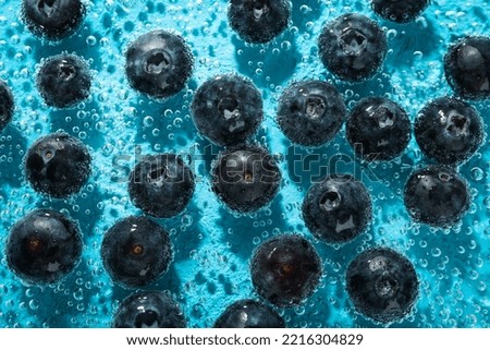 Concept of fresh summer fruits, blueberry in water