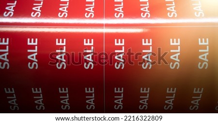 Red stickers with the inscription sale. Preparing for Black Friday in hypermarkets. Printing on a large-format printing press.