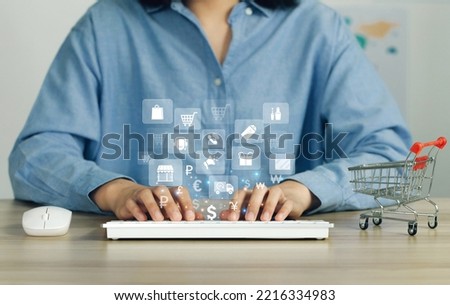 Women's hands are using a computer keyboard with online shopping icons to Search for information. online shopping concept.Black Friday