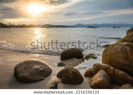 Sunset on ocean Jurere beach in Florianopolis, Southern Brazil