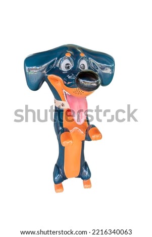Statue of a dog, breed, coon hound, blue with white background s extending two legs with a happy expression and isolated