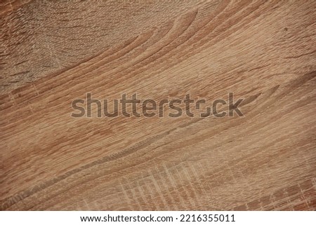 texture of brown wood with dark and light stripes and veins