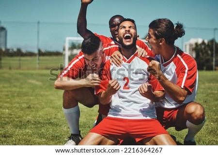 Success, happy team or winner for soccer player celebration during match at soccer field, stadium or sport workout. Teamwork, achievement or friends for fitness goal, wellness or football exercise. Royalty-Free Stock Photo #2216364267
