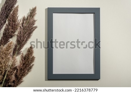 Frame mockup and dried natural pampas grass. Interior decoration element. mockup blank diploma frame on white wall background. Frame with blank White paper , dried grass decoration. square image