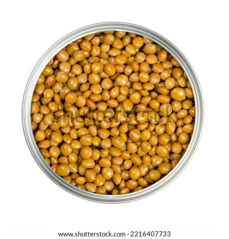 Lentils in an opened can. Cooked and canned small brown lentils, seeds of Lens culinaris, a legume and staple, used for thick curry, gravy or dal. Isolated, from above, close-up, macro food photo.