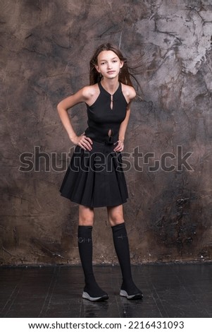 Full body studio portrait of a young teen girl