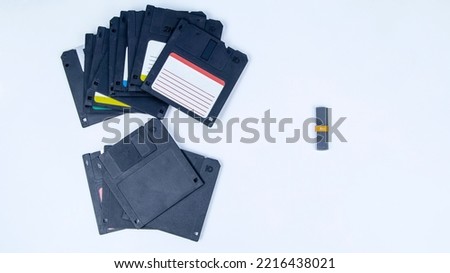 obsolete computer floppy disks with a flash drive on a white background, isolated, mock-up