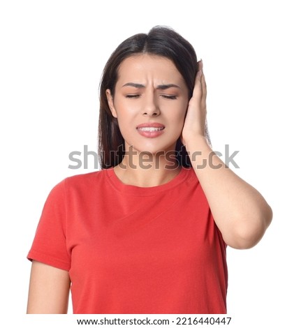 Young woman suffering from ear pain on white background Royalty-Free Stock Photo #2216440447