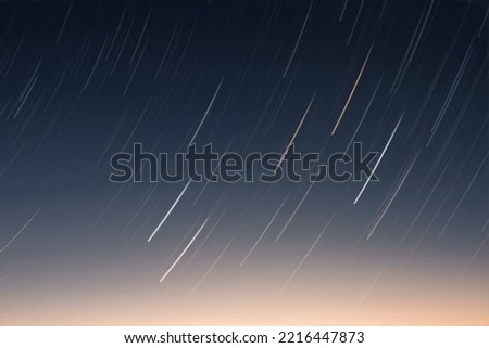 Background of round or circular star track or trajectory on the blue clear night sky. Symbol of space, cosmos, expanse infinity and universe with hraim and blurred.
