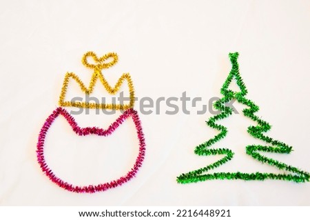 merry christmas. happy new year. xmas decoration. winter holiday party tinsel decor. festive background. fir tree and cat in crown isolated on white.