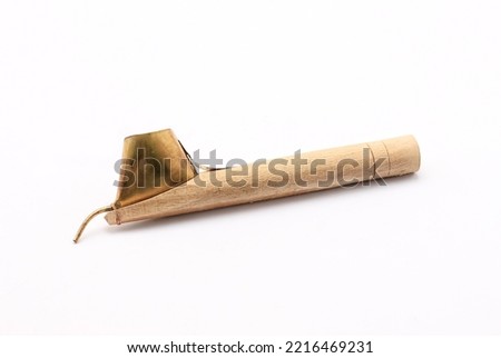 close up of hand hold canting is tool for make batik with isolated white background. Canting batik is tools to make batik. canting batik is used to put wax. canting consists of three type. Royalty-Free Stock Photo #2216469231