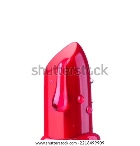 Beautiful red lipstick with water or gel moisturizer drops isolated on white background, close up