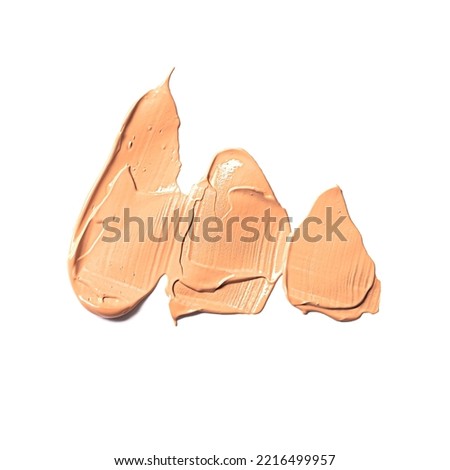 Tone cream smear smudge swatches isolated on white background. Beige color cosmetic product swipe sample