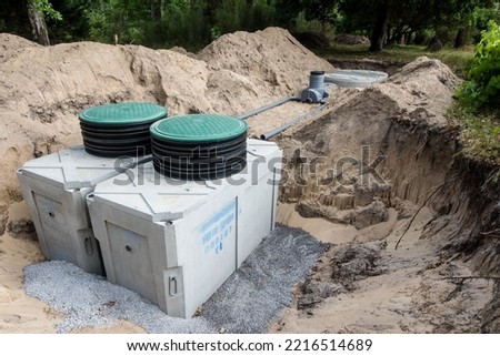 Installation of an autonomous sanitation station for a detached house Royalty-Free Stock Photo #2216514689