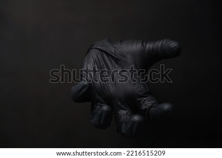 Background of hands in gloves. Black gloves. Hand gestures black gloves.