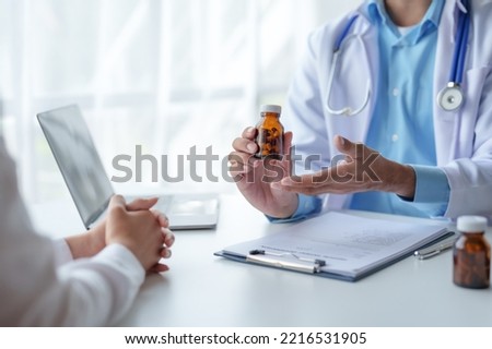 Doctor who records a patient's detailed information or medication history is evaluating medications and vaccines for the intended treatment. or if there are any side effects. Royalty-Free Stock Photo #2216531905