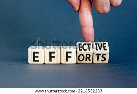Effective efforts symbol. Concept words Effective efforts on wooden cubes. Businessman hand. Beautiful grey table grey background. Business effective efforts concept. Copy space. Royalty-Free Stock Photo #2216532233