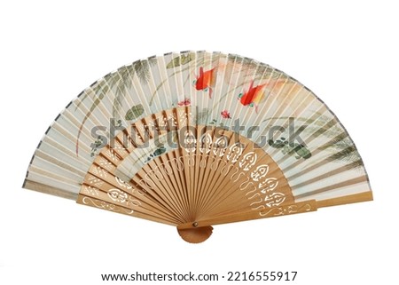 Hand-painted vintage oriental fan with a pond and goldfish, isolated on white.