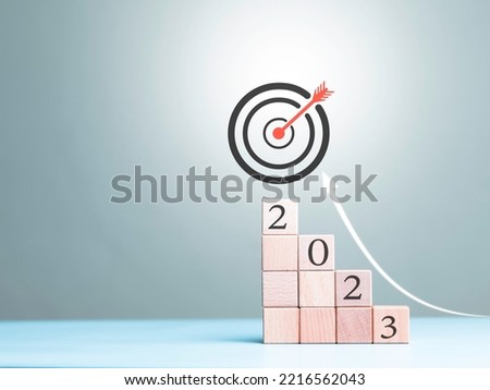 Dart board, conceptualization to lead to the right goal. cube block to contain the purpose of doing business overcoming. Developing ideas for the new year 2023 