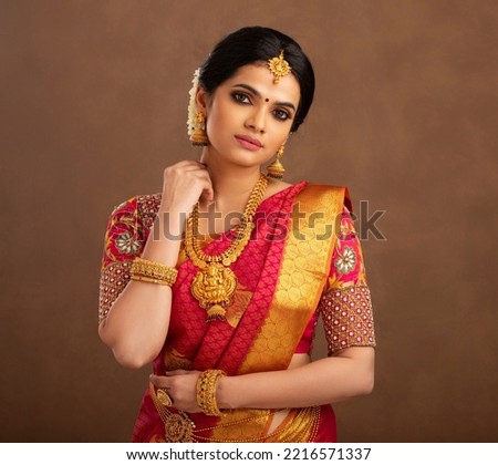 Beautiful Indian bride in studio shot. Royalty-Free Stock Photo #2216571337