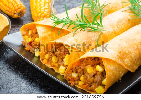 Tomato tortilla with spicy meat mixture, jalapeno, thyme and corn