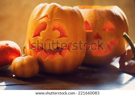 Halloween pumpkins on wooden board