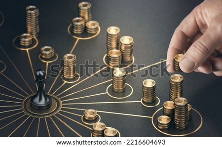 Man puting golden coins on a board representing multiple streams of income. Concept of multiplying sources of revenue. Composite image between a 3d illustration and a photography. Royalty-Free Stock Photo #2216604693
