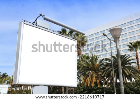 Blank billboard ad. Empty white advertisement with copy space in a big city.