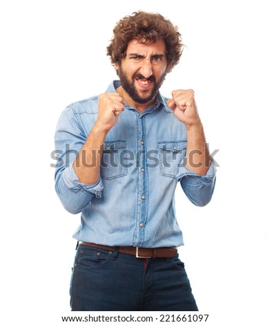 young crazy man angry and celebrating gesture