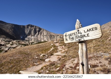 National Park trail sign placed where trails diverge in alpine tundra - Rocky Mountain National Park, Colorado, USA Royalty-Free Stock Photo #2216621867