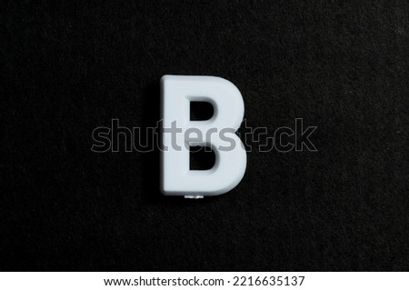Letter B on a black background Royalty-Free Stock Photo #2216635137