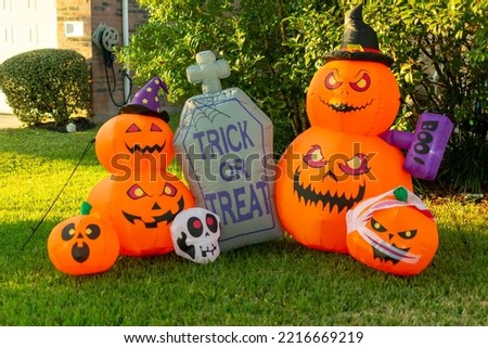 Halloween pumpkin, skull, and tombstone decoration.