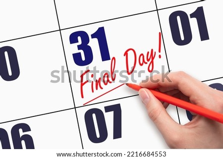 31st day of the month. Hand writing text FINAL DAY and drawing a line on calendar date. A reminder of the last day. Deadline. Business concept Day of the year concept. Royalty-Free Stock Photo #2216684553