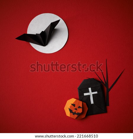 Halloween symbols origami bat on moon and pumpkin on a red background