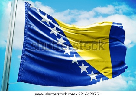 Waving flag on a pole of country Bosnia