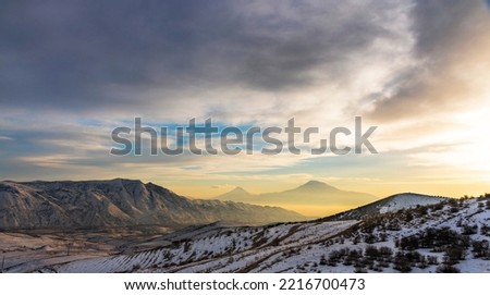 Mount Ararat. Beautiful sunset.Mountains in the clouds orange clouds,